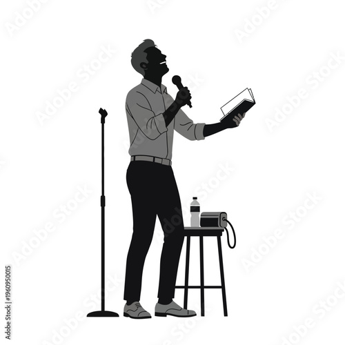 Man speaking into microphone holding book.