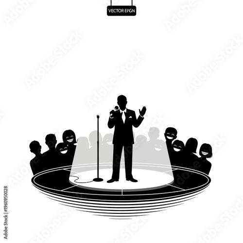 Man speaking on a stage microphone.