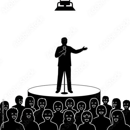 Man speaking on stage to audience.