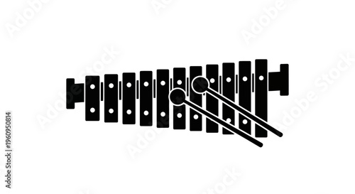 A black xylophone with mallets on a for music concept