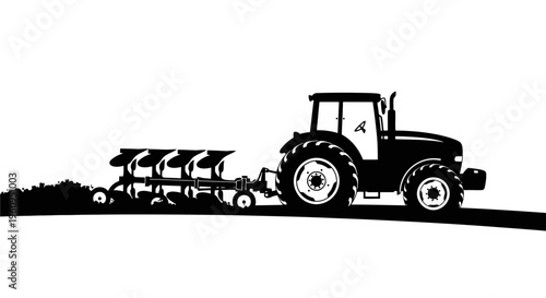 Black silhouette of a tractor pulling a planter on a in a field