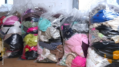 Used clothes in bags for recycling and donation