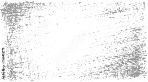 Textured grey scratches and speckles on a white background grunge