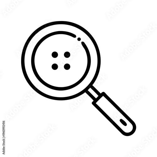 Magnifying glass inspecting clothing button with four holes, concept of detail examination
