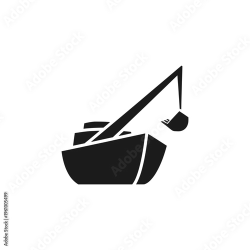 Dredging boat with crane and bucket in silhouette.