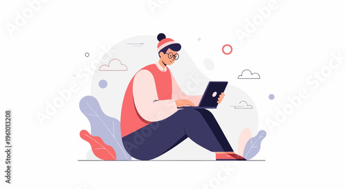 Person wearing a beanie and glasses, sitting and typing on a laptop