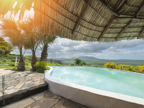Blue pool on tropical background