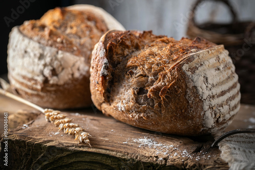 Fresh wheat bread on an old wooden table