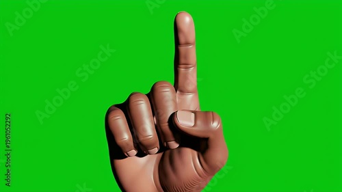 Human hand with index finger raised on a bright green background
