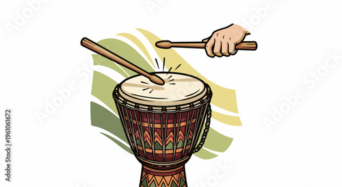 Person's hand playing a patterned drum with drumsticks