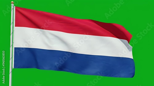 A tri-color flag with red, white, and blue stripes, waving on a pole against a green backdrop