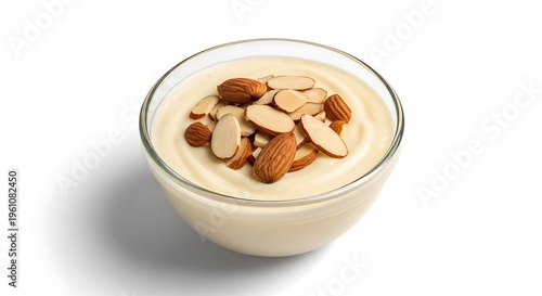 Glass bowl of creamy pudding topped with almonds