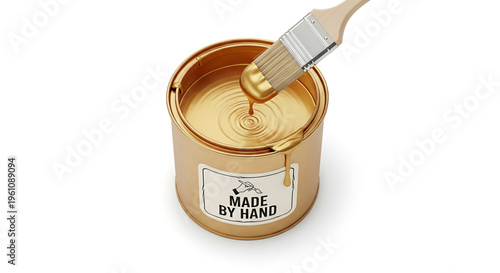 A paintbrush dipping into a can of golden paint with a made by hand label