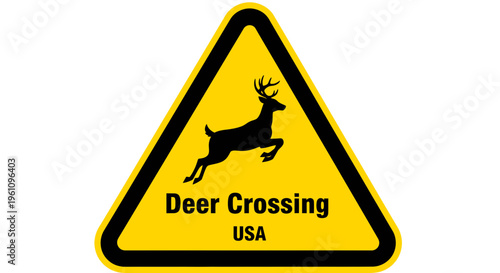 Bright yellow triangular warning sign displaying a black silhouette of a leaping deer, clearly indicating a designated wildlife crossing zone for motorist safety on roads