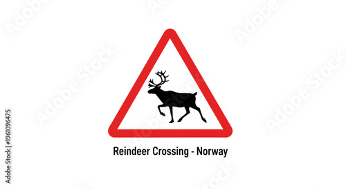 Prominent triangular road warning sign with a black reindeer silhouette on a white background, alerting drivers to a wildlife crossing area