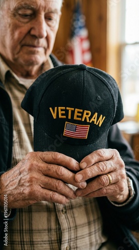 Elderly man holding veteran cap