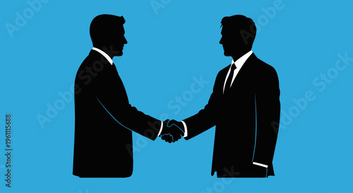 Two businessmen shaking hands in agreement.