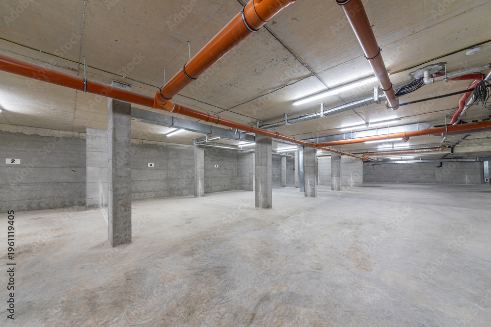 Obraz premium Underground Parking Garage. Modern Infrastructure for Mobility, Safety, and Urban Planning Concepts