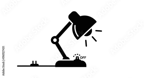 Black desk lamp on switch plate.