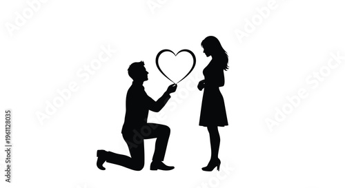 A man proposes to a woman holding a heart shaped frame silhouette