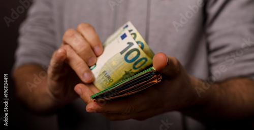 Cuadro en lienzo Close-up of hands holding Euro banknotes, symbolizing wealth, finance, money, an