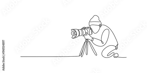 Continuous line drawing of a professional photographer with a camera on a tripod taking a photo.