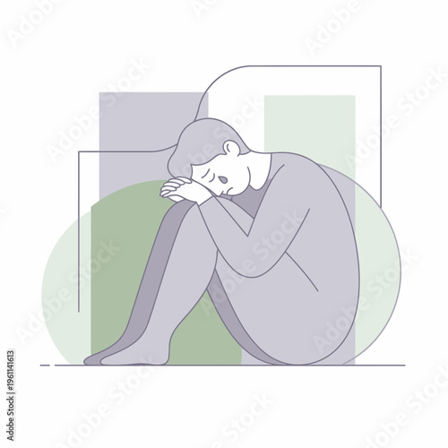 Depressed person sitting alone in a fetal position.