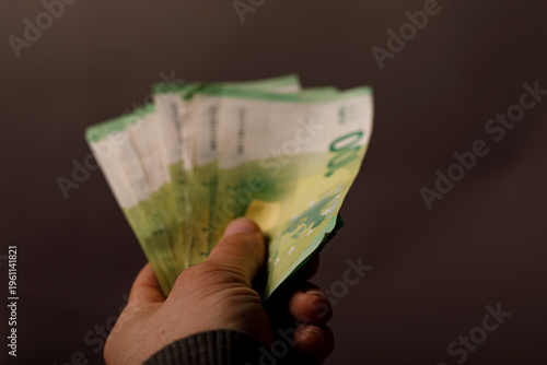 Hand holding euro banknotes...