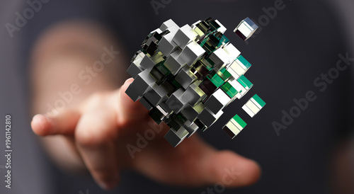 Photos Abstract image of a hand interacting with a 3D cube representing technology, data, and connection