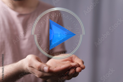 A person holds a digital pl...