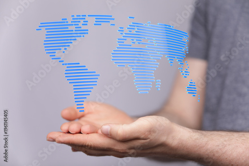 Person holding digital worl...
