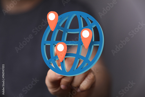 Hand holding a globe with l...