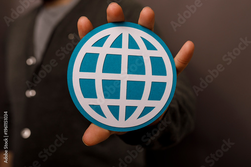 Person holding a globe symb...