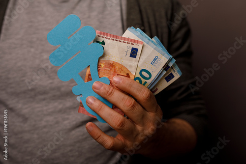 Hand holding euro banknotes...