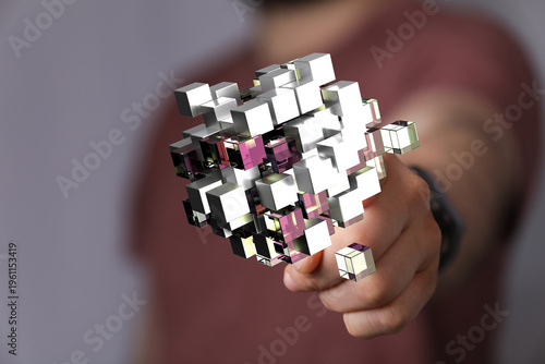 Creative abstract illustration with cubes, hand holding a digital 3D model, technology or futuristic concept. Science, A