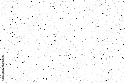 Irregular black blotches and tiny specks appear scattered across a bright white plain offering stark visual contrast