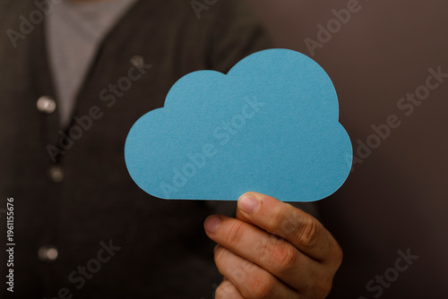 Person holding a blue cloud...
