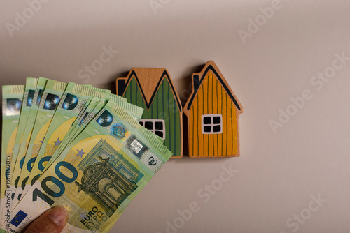 Hand holding Euro banknotes...