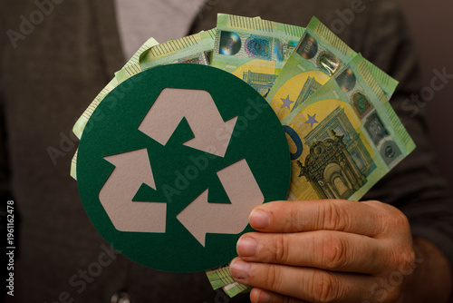 Person holding cash with re...