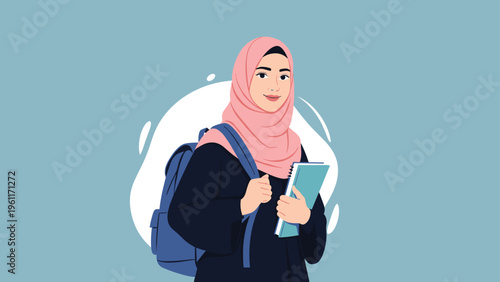 Smiling young Muslim woman wearing a pink hijab and dark dress carrying a blue backpack and holding notebooks while standing against a blue background.