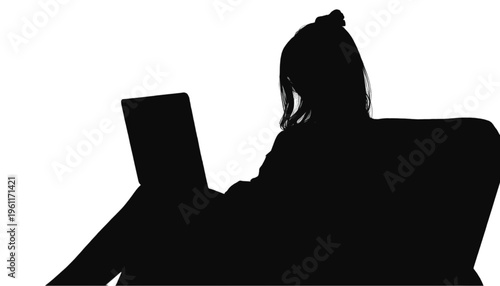 Shadow outline of an individual relaxing backward in an armchair while using a modern portable machine.