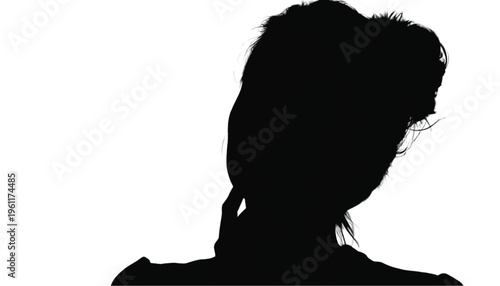 Shadowy profile of an individual with messy hair looking away from the viewer in high contrast.
