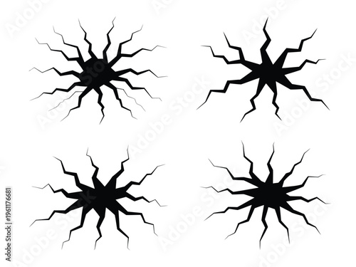 Four black cracked hole shapes isolated on white background for design