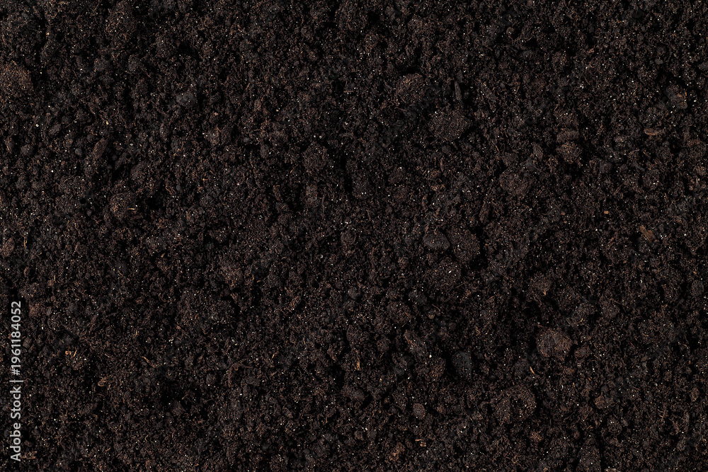 Fototapeta premium Fertile agricultural soil as background, top view. Mixed soil with peat added to improve fertility. Organic compost mixed with agricultural soil.