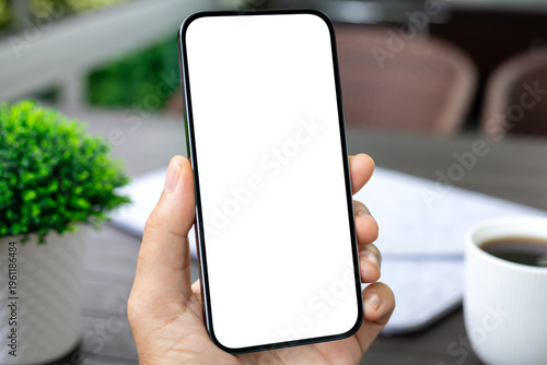 man hand hold phone with isolated screen background table office