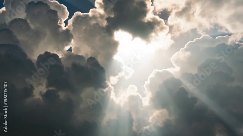 Sunlight glistens through the clouds, creating a ray of hope, presence of a higher power