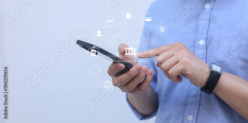 businessman hand hold smartphone and use private banking account application to using system function about checking stock market or transfer money worldwide for future tech concept