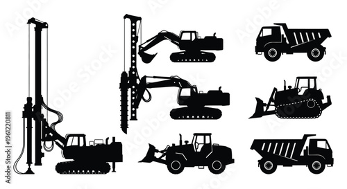 Construction machinery including cranes excavators and trucks in dark silhouette
