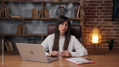 Business woman talks about strategies for success while engaging with the audience online.