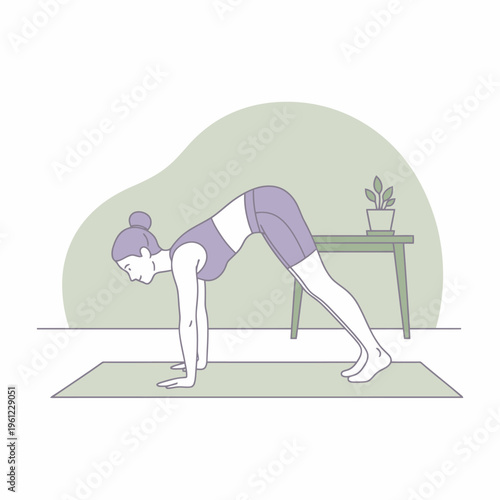 Woman performing yoga downward facing dog pose on mat.